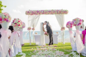 Romantic beachside wedding ceremony with floral decor – About Tanmay Events destination wedding planning.