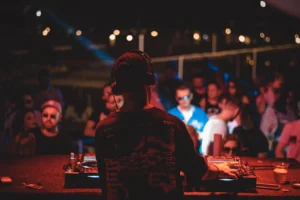 Live DJ performance at a vibrant night party – About Tanmay Events corporate and entertainment event services.