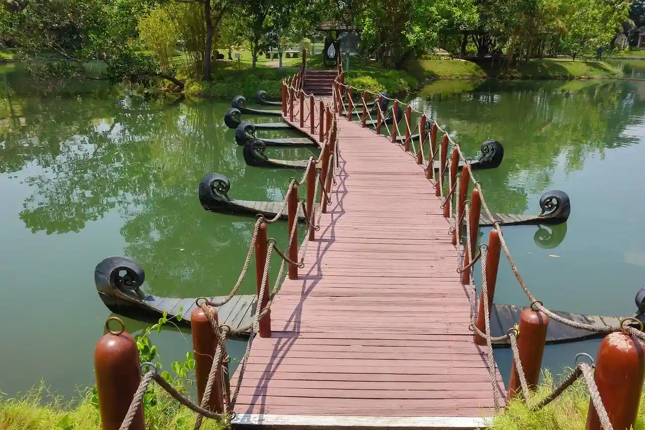 Scenic venue location with wooden bridge, curated by leading event decorators in Thrissur for nature-themed functions,it is for the best event management services in thrissur